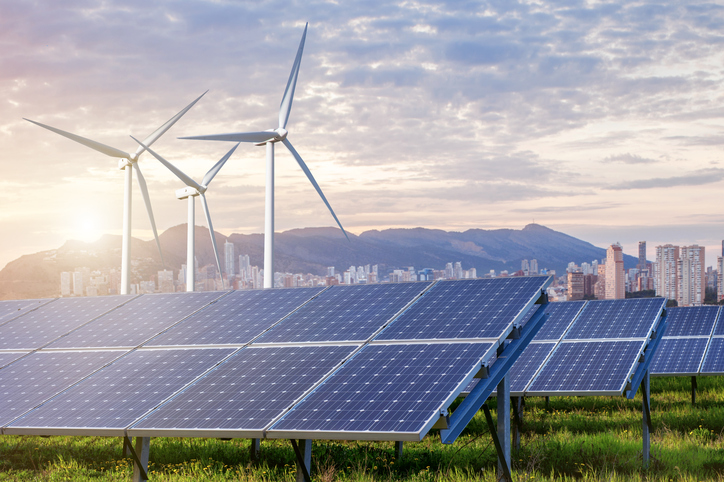 Solar panels and wind turbines with city