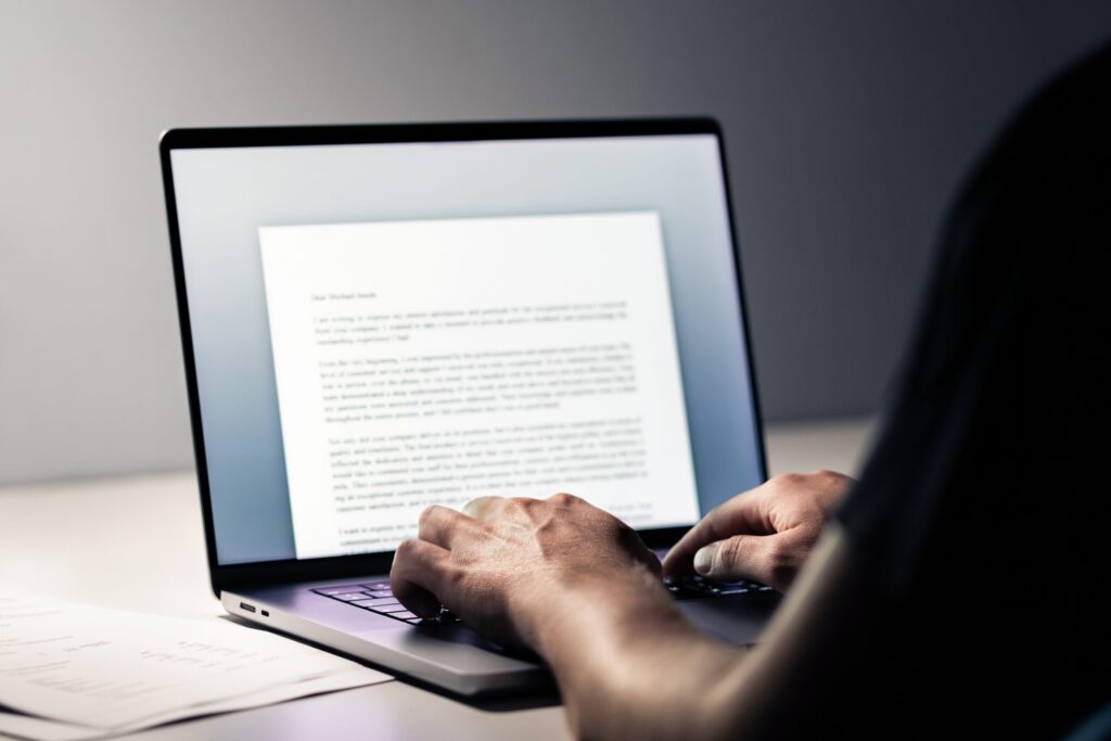 writing a letter at a computer