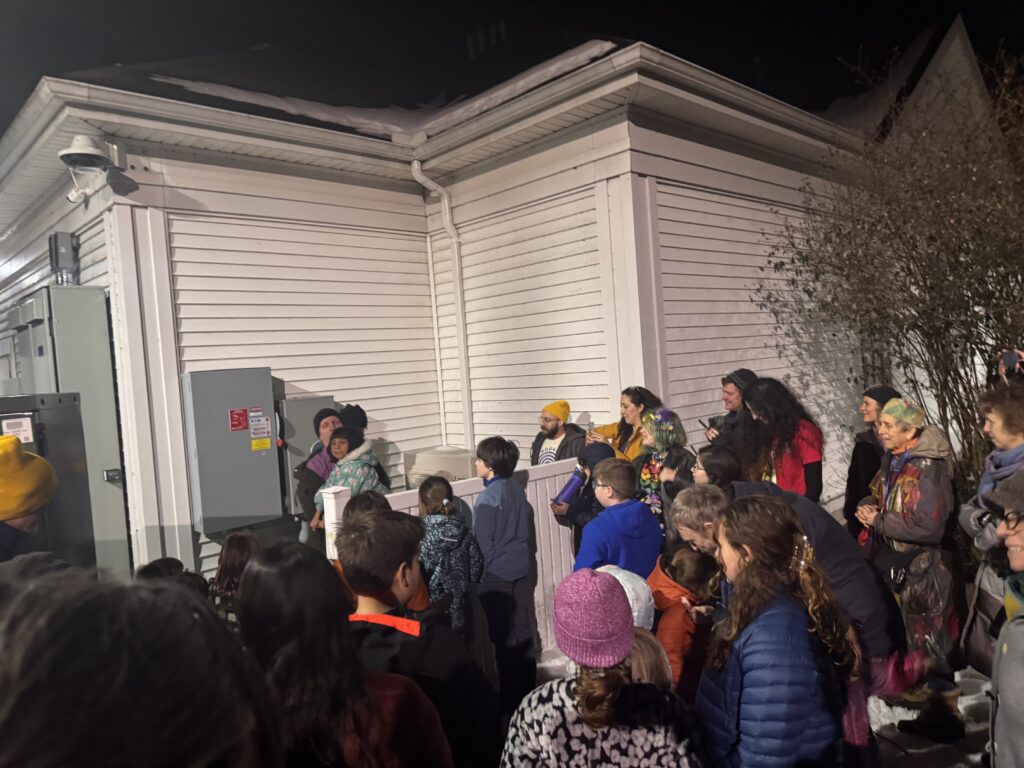 Jewish Community of Amherst Celebrates Hanukkah with Energizing of Solar Canopy