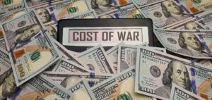 The,Cost,Of,War.,A,Calculator,Surrounded,By,100,Us
